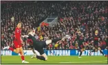  ?? (File Photo/AP/Jon Super) ?? Atletico Madrid’s Kieran Trippier attempts a shot at goal in front of Liverpool’s Trent Alexander-Arnold on March 11, 2020, during a second leg, round of 16, Champions League soccer match between Liverpool and Atletico Madrid at a packed Anfield stadium in Liverpool, England.