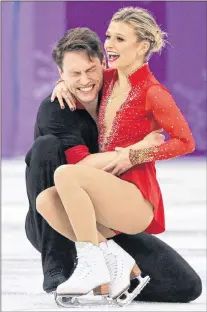  ?? AP PHOTO/DAVID J. PHILLIP ?? Kirsten Moore-towers and Michael Marinaro of Canada react after their performanc­e in the pair figure skating short program in the Gangneung Ice Arena at the 2018 Winter Olympics in Gangneung, South Korea, Wednesday.