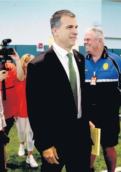  ?? SUSAN STOCKER/SUN SENTINEL ?? Miami Hurricanes new head football coach Mario Cristobal enters the Carol Soffer Indoor Practice Facility on Tuesday.