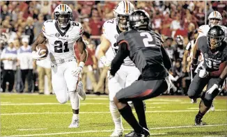  ?? MICHAEL WOODS / ASSOCIATED PRESS ?? Kerryon Johnson carries the load for Auburn’s ground game, ranking second nationally with 14 rushing touchdowns despite missing two games with a hamstring injury.