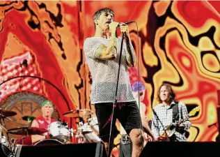  ?? Dave Simpson/WireImage ?? Chad Smith, Anthony Kiedis, Flea and John Frusciante of the Red Hot Chili Peppers perform at Mt Smart Stadium in Auckland, New Zealand, on Jan. 21.