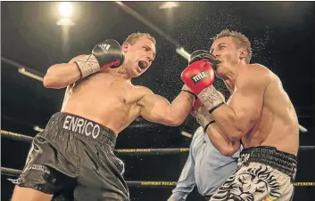  ?? PHOTO: ANTON GEYSER/GALLO IMAGES ?? Ryno Liebenberg, right, is contemplat­ing his future following his loss to German Enrico Koelling at Emperors Palace last weekend.