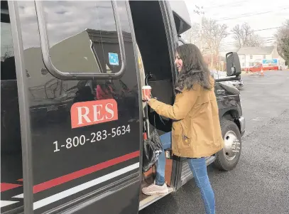  ?? PHOTOS BY HALLIE MILLER/BALTIMORE SUN ?? Theresa “Tree” Themelis boards the “canna crawl” bus after a stop at Your Farmacy dispensary in Luthervill­e-Timonium.