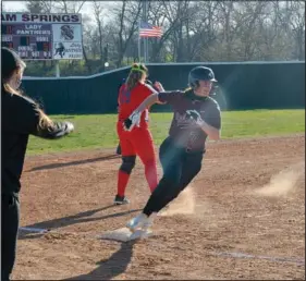  ?? (NWA Democrat-Gazette/Graham Thomas) ?? Brooke Smith, Siloam Springs sophomore, rounds third base on her way home during the first inning of Monday’s softball game at La-Z-Boy Park.