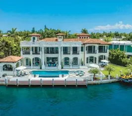  ?? DANNY PETRONI/THE JILLS ZEDER GROUP ?? Built in 2002, this 11,552-square-foot waterfront smart home was recently gut-renovated and includes outdoor features such as an infinity saltwater pool, a private dock, a summer kitchen and a gazebo.