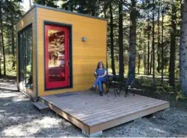  ??  ?? Travel editor Jennifer Bain stays in a micro-cube, an innovative comfort camping option for reluctant campers. It has a bed, electricit­y and a lock, but no heat.