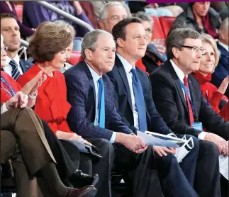  ??  ?? Games: David Cameron on his US tour watching basketball with George Bush