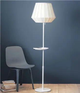  ?? AP ?? From Ikea, the VARV floor lamp, which allows you to charge two devices at once with a USB port built into the lamp, and a built in charger on the table for wireless charging.