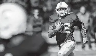  ?? STAFF FILE PHOTO BY DOUG STRICKLAND ?? UTC backup quarterbac­k Tyler Roberson, shown running during a practice this past spring, also has played on special teams during his first two seasons with the team.