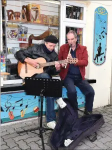  ??  ?? Busker Kit McCafferty (left) with Kit Dunlop of The Soundz of Music, Henry Street, Kenmare. Photo by Michelle Cooper Galvin