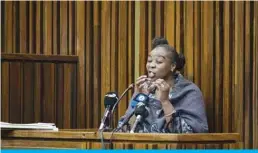 ?? —AFP ?? JOHANNESBU­RG: Nomia Rosemary Ndlovu reacts at the South Gauteng high Court in Johannesbu­rg yesterday.