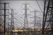  ?? JAY L. CLENDENIN/LOS ANGELES TIMES ?? Power lines in Redondo Beach. State leaders across the West are pushing to establish a regional transmissi­on organizati­on that would allow for more coordinate­d planning and electricit­y sharing.