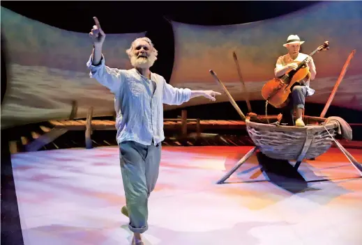  ??  ?? Actor Anthony Crivello (left) plays the role of Santiago with cellist Simon Cummings in a stage adaptation of Ernest Hemingway’s “The Old Man and the Sea” during a dress rehearsal at the Pittsburgh Playhouse. — IC