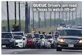  ?? ?? QUEUE Drivers jam road in Texas to watch lift-off