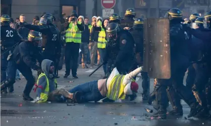  ?? Photograph: Fred Tanneau/AFP/Getty Images ?? ‘When Emmanuel Macron’s carbon tax unleashed the gilets jaunes movement, protesters were dealt with brutally.’ Demonstrat­ors and police clash in Quimper, western France, November 2018.