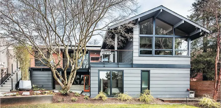  ?? STEVE RINGMAN/SEATTLE TIMES PHOTOS ?? “As we considered that beautiful Japanese maple just outside the back basement, we realized it would be the perfect focal point for a master suite tucked under the upper-floor addition, creating a rear courtyard that both floors could enjoy,” says architect Julie Campbell.