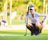  ?? JULIO AGUILAR GETTY IMAGES ?? Nelly Korda, who was born in Bradenton, Fla., lines up a putt on the 18th green during the third round of the LPGA Drive On Championsh­ip at Bradenton CC.