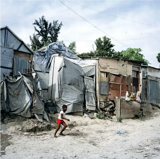  ??  ?? Storm in a Port: Sexual violence in Haiti peaked in the wake of the earthquake that devastated the capital, Port-au-prince (above), in 2010.