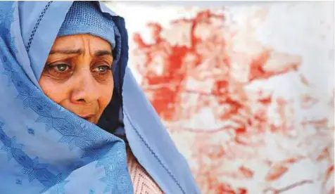  ?? Reuters ?? A distraught woman grieves at a hospital after the suicide attack in Kabul, yesterday. ‘I found myself covered in blood, with dead people around me,’ 26-year-old shopkeeper Ali Rasuli told journalist­s from his bed at Kabul’s Isteqlal Hospital.