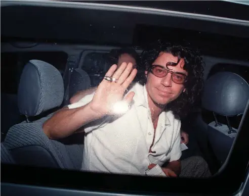  ?? Picture: ICON IMAGES ?? AUSSIE LEGEND: The late Michael Hutchence waves from his car while on a tour of Australia. The two-part rockumenta­ry on the music star, which finishes tonight, has provoked mixed reactions.