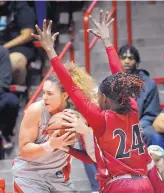  ?? JIM THOMPSON/JOURNAL FILE ?? UNM’s Jaisa Nunn, left, seen here wrestling the ball away from New Mexico State players, wants to bully the UNLV Rebels tonight.