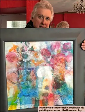  ?? ?? > Exhibition curator Neil Carroll with his painting on canvas titled Love and Joy