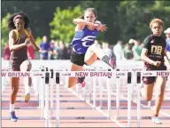  ?? Arnold Gold / Hearst Connecticu­t Media ?? Fairfield Ludlowe’s Tess Stapleton, center, runs to a first-place finish in the 100-meter hurdles at the CIAC State Open Outdoor Track & Field Championsh­ip on June 3, 2019.