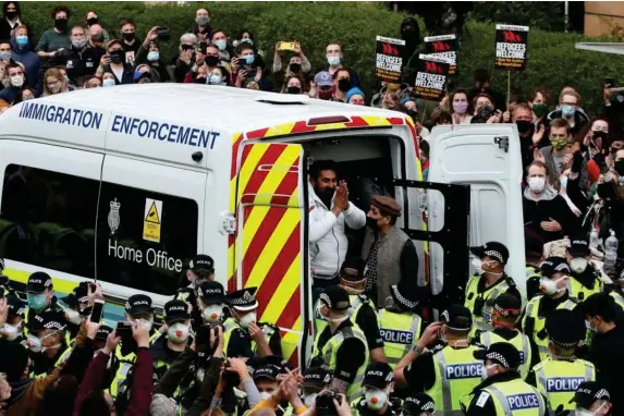  ?? (PA) ?? One of the two detained men thanks crowds in Kenmure Street, Glasgow, on Thursday