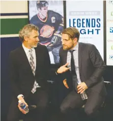  ?? ARLEN REDEKOP ?? Former Canuck captains Trevor Linden and Markus Naslund chat Monday before being honoured during Canucks Legends Night.