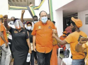  ??  ?? Mark Golding gets his supporters on their ‘marks’ at the PNP’S National Executive Council (NEC) meeting, yesterday.