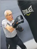  ?? CP PHOTO ?? Murray Isaac, who suffers from Parkinson’s disease, works out on the punching bag at the Grizzly Cage Boxing Club in Calgary, Alta., last month.