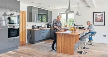  ??  ?? SITTING PRETTY: The Olivers’ timber-frame, self-build home boasts this spacious kitchen