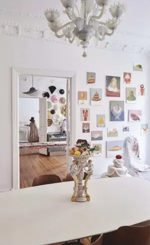  ??  ?? A view of milliner and artist Maryam Keyhani’s studio from the dining room in her Berlin home (page 49); paintings by Maryam Keyhani in collaborat­ion with her father, artist Mostafa Keyhani.
