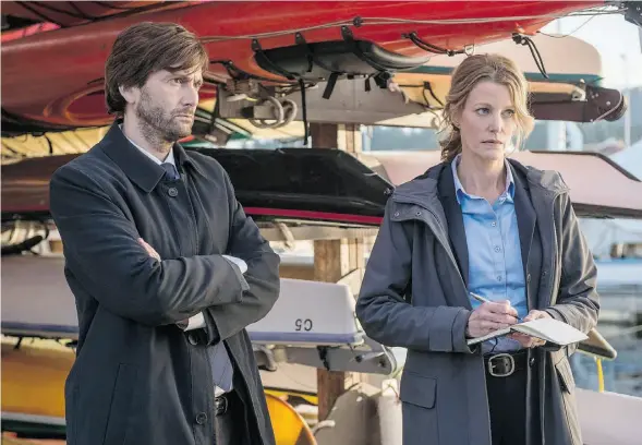  ?? ED ARAQUEL/FOX ?? David Tennant, left, and Anna Gunn in Gracepoint, the new Americaniz­ed version of the highly successful U.K. miniseries Broadchurc­h.