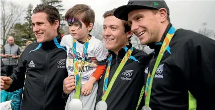  ?? PHOTOS: CHRISTEL YARDLEY / FAIRFAXNZ ?? Three-year-old Charlie Thompson wore a homemade T-shirt celebratin­g the medal-winning New Zealand sprint team of, from left, Sam Webster, Ethan Mitchell and Eddie Dawkins.