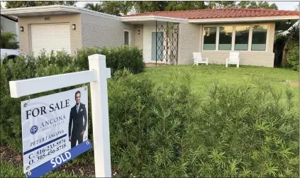  ?? ASSOCIATED PRESS FILE PHOTO ?? A home with a “Sold” sign is shown, Sunday, May 2, 2021, in Surfside, Fla. It’s been a bumpy ride for mortgage companies lately. Some lenders have gone out of business, merged with other companies or narrowed their focus. And more changes are likely in 2023. But the shakeout shouldn’t set you off course.