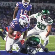  ?? Joshua Bessex / Associated Press ?? Bills running back Devin Singletary scores a touchdown against the Jets on Sunday.