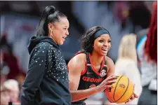  ?? NELL REDMOND/AP PHOTO ?? In this Feb. 26 file photo, South Carolina head coach Dawn Staley, left, laughs with Georgia guard Diamond Battles during the second half of a game in Columbia, S.C.