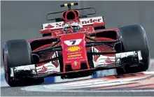  ?? GIUSEPPE CACACE/ AFP/GETTY IMAGES ?? Ferrari’s Kimi Raikkonen takes a corner during Friday’s second practice session ahead of the Abu Dhabi Formula One Grand Prix at the Yas Marina circuit.