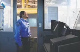  ?? Jessica Christian / The Chronicle ?? Vallejo native Sonny Hasme gazes out from one of the toll booths that he once worked in at the Carquinez Bridge toll plaza.