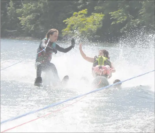  ?? GORDON LAMBIE ?? Children at the Arthritis Society's "Kids on the Move Camp" made the most of Lake Massawippi on Tuesday Morning with a round of adapted water-skiing.