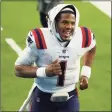  ?? Katelyn Mulcahy / Getty Images ?? Quarterbac­k Cam Newton of the Patriots jogs toward the locker room after Sunday’s game.