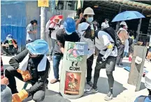  ??  ?? Demonstrat­ors attend a protest against the military coup in Yangon, Myanmar