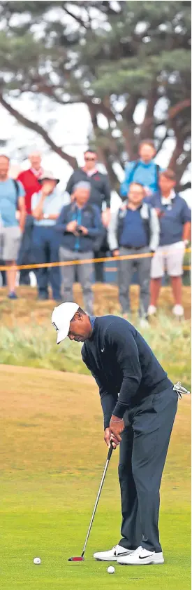  ?? Pictures: SNS/Getty/PA. ?? Tiger Woods, putting on the ninth green and teeing off on the fifth during practice yesterday, top right, wants to follow in the footsteps of Tom Watson, centre right, and Greg Norman.