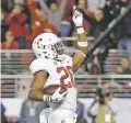 ?? AP FILE PHOTO ?? Stanford running back Bryce Love celebrates scoring a touchdown against Southern California during the Pac-12 Conference championsh­ip Dec. 1 in Santa Clara, Calif. Love was selected to the AP preseason AllAmerica team Tuesday.
