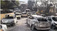  ??  ?? Un cementerio de carros incinerado­s en Ática.