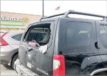  ?? TIMES photograph by Annette Beard ?? A 4-month-old boy was rescued from this vehicle in the parking lot at the Walmart Neighborho­od Market in Pea Ridge Sunday afternoon when Nathaniel Holt broke the back glass with a brick, unlocked the vehicle and his wife, Michelle, got the child out.