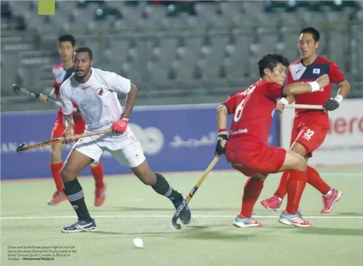  ?? — Mohammed Mahjoub ?? Oman and South Korea players fight for the ball during the Asian Champions Trophy match at the Sultan Qaboos Sports Complex in Muscat on Tuesday.
