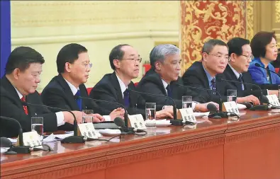  ?? XING GUANGLI / XINHUA ?? Leaders from non-Communist parties and the All-China Federation of Industry and Commerce attend a news conference during the first session of the 13th National Committee of the Chinese People’s Political Consultati­ve Conference in Beijing on Tuesday.