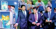  ??  ?? The Managing Director of Nestle Lanka PLC Ganesan Ampalavana­r is seen operating the cold vending machine of Nestle iced lemon tea, while the Head of Nestle Profession­al for Nestle Lanka Jagath Wedage (middle) and Vice President for Nestle Lanka...